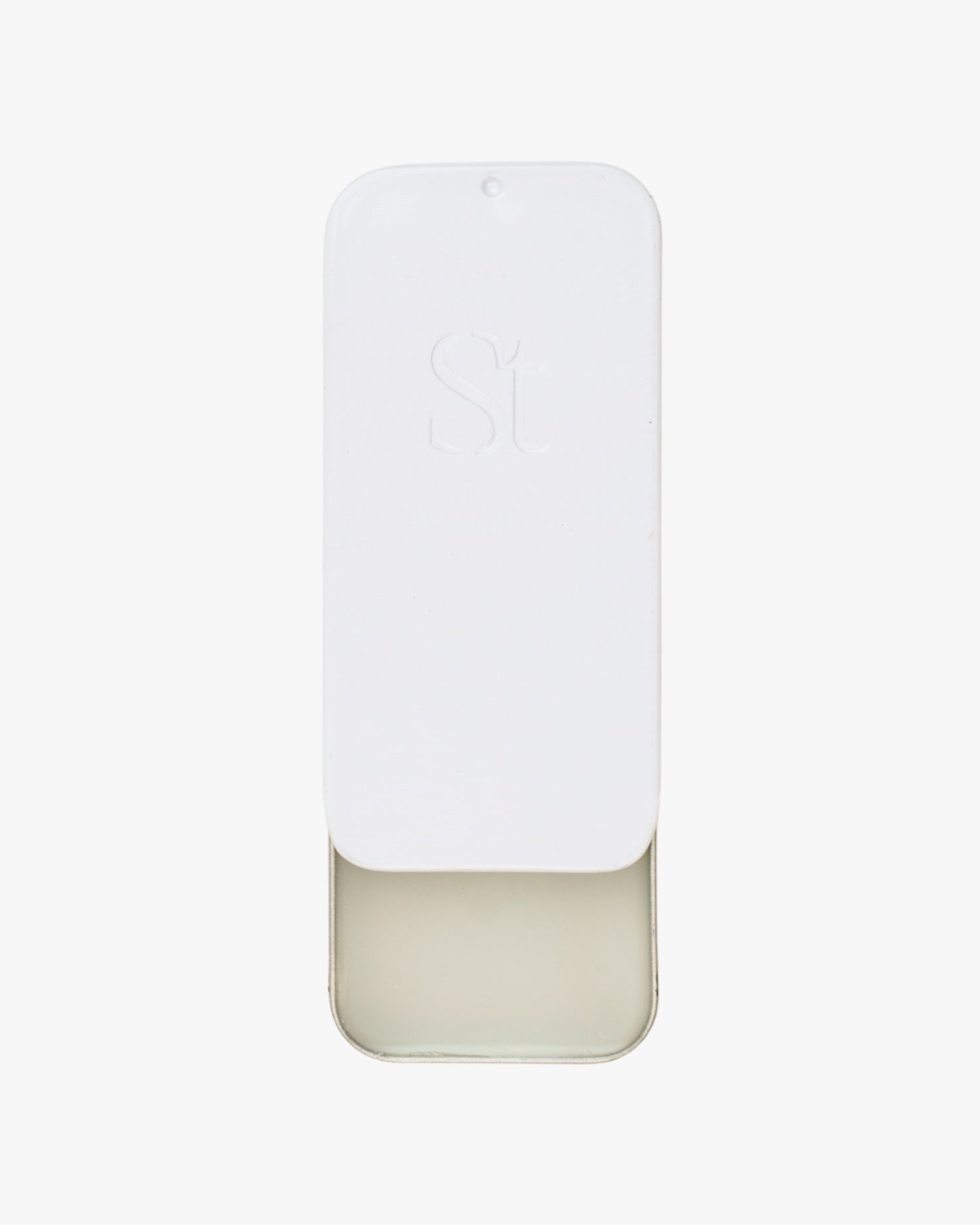 Seint Saved Salve white slide-top tin with embossed logo, lid partly open to reveal the clear conditioning balm
