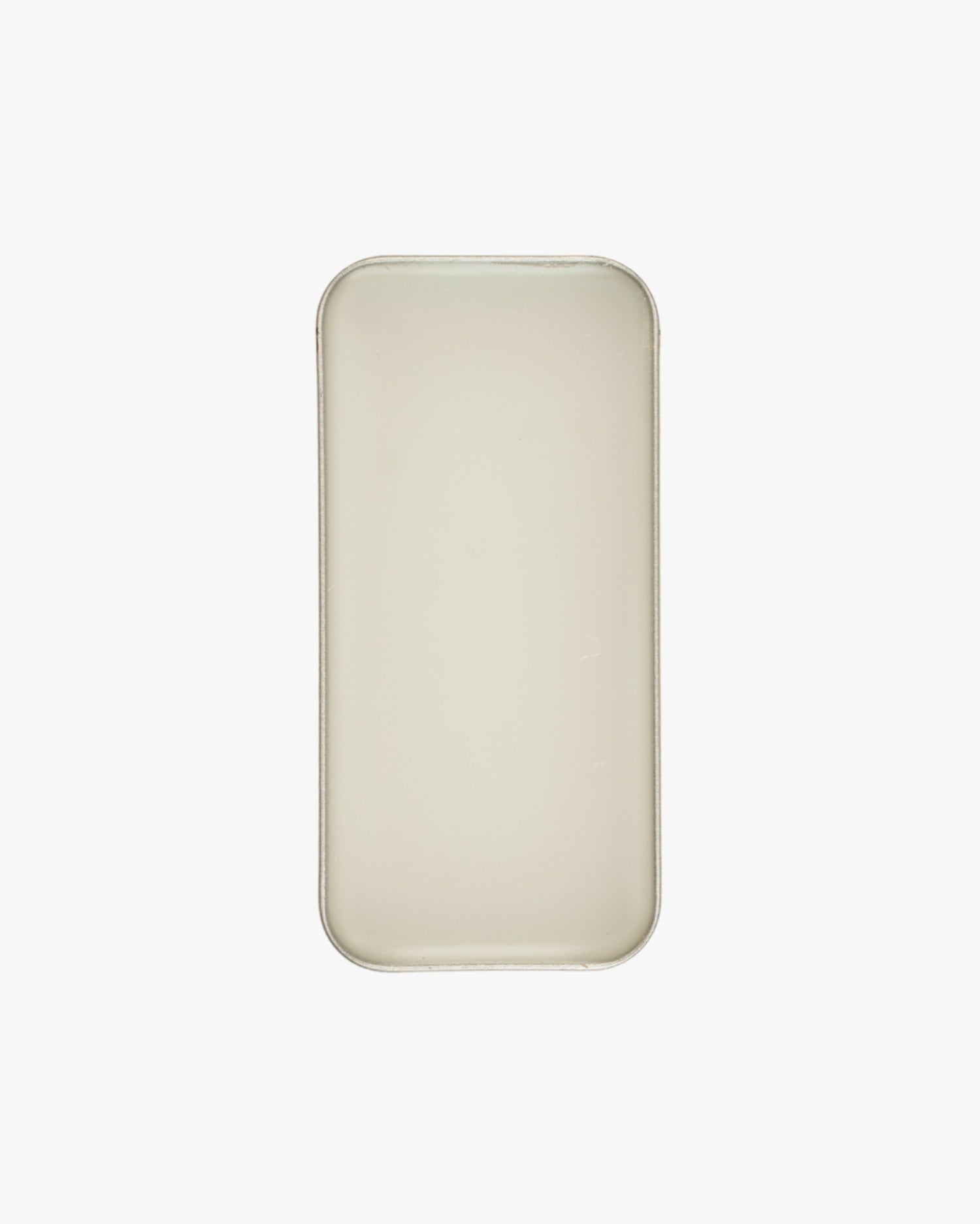 Seint Saved Salve open tin viewed from above, filled edge to edge with smooth ivory balm